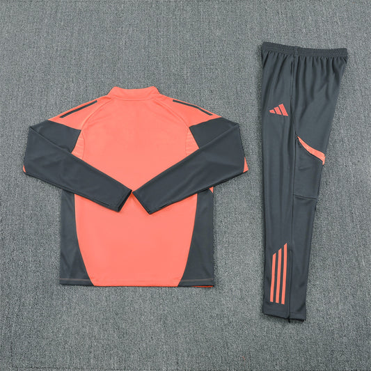 back view of the Bayern Munich 25/26 Quarter-Zip Tracksuit Orange top and grey pants