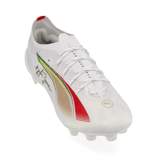 front view of the PUMA Ultra 5 Ultimate FG Senna in White/Gold/Red colorway