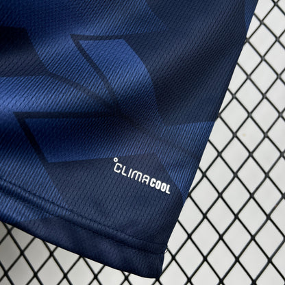 Adidas Scotland 2026 World Cup Home Navy blue fabric with geometric pattern and 'ClimaCool' logo on a wire mesh background