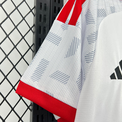 Adidas UAE 2026 World Cup Home White Jersey with red accents and Adidas logo on a black and white checkered background