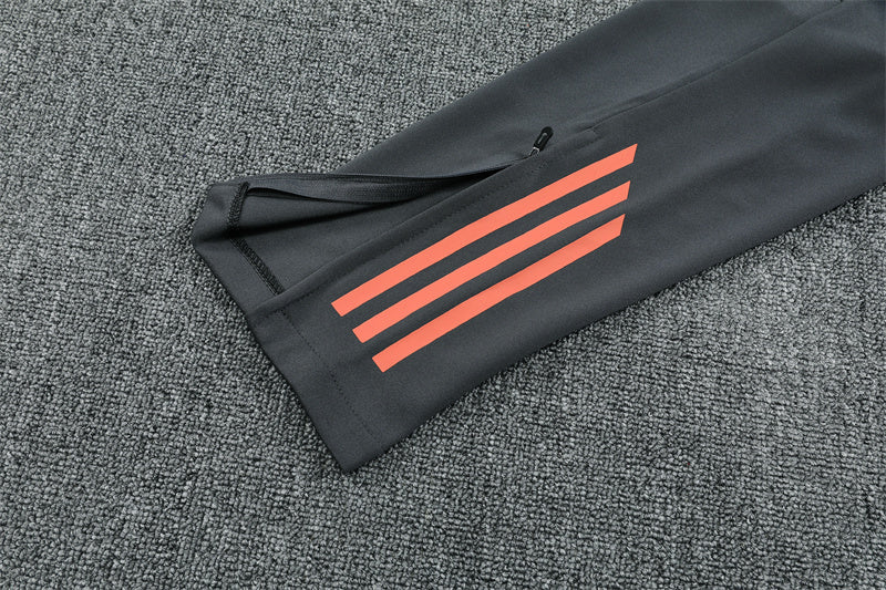 Bayern Munich 25/26 Quarter-Zip Tracksuit Orange top and grey pants sleeve view