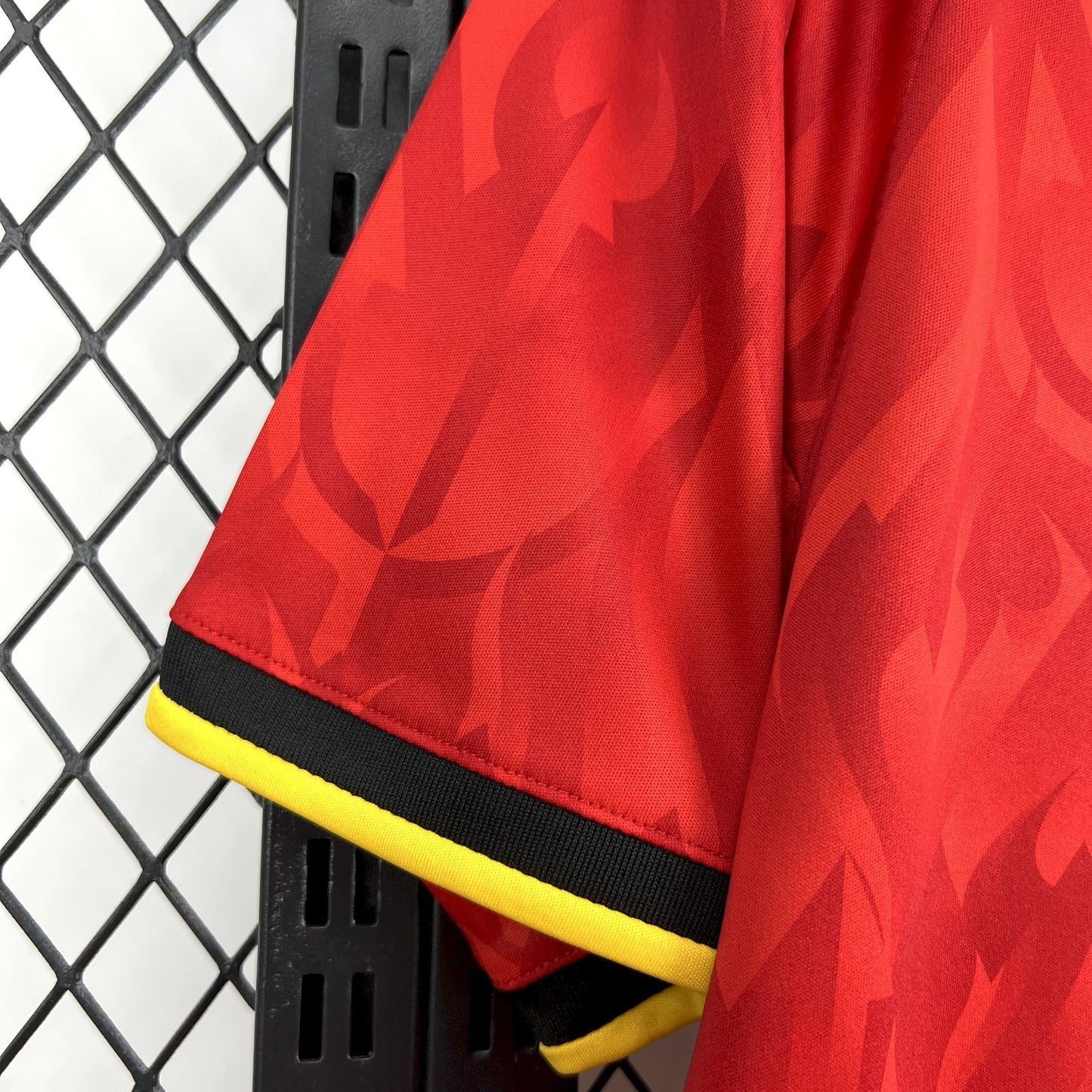 Sleeve view of the Belgium 2026 Home World Cup Red Jersey with black and yellow crests.