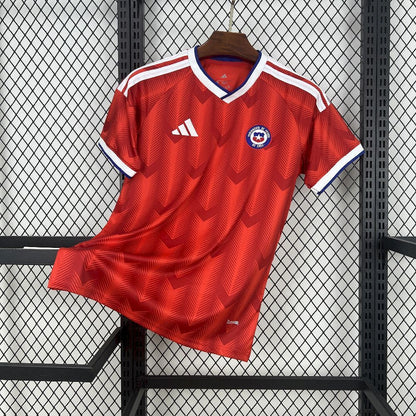 Front view of Chile 2026 Home Worldcup Jersey, in a red colorway, showing the teams logo and Adidas crest.