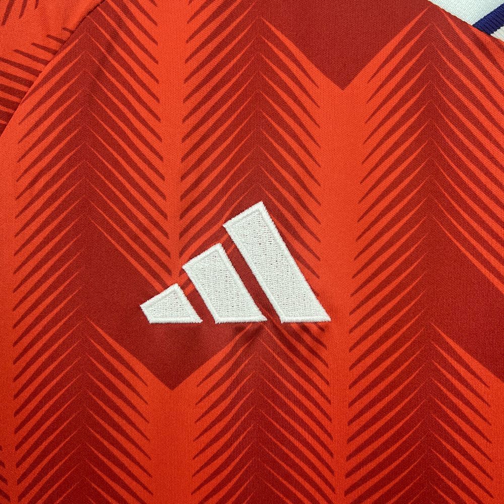Close-up of the Adidas logo on the Chile 2026 Home Worldcup red Jersey.