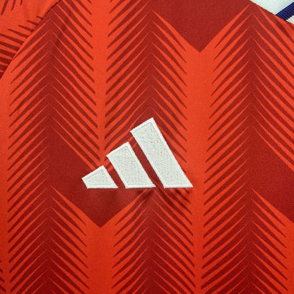 Close-up of the Adidas logo on the Chile 2026 Home Worldcup red Jersey.