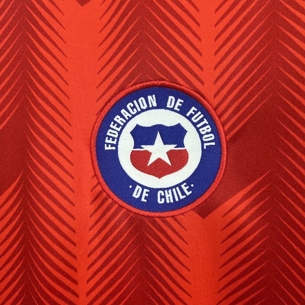 Federacion De Futbol De Chile logo on their 2026 home red jersey.