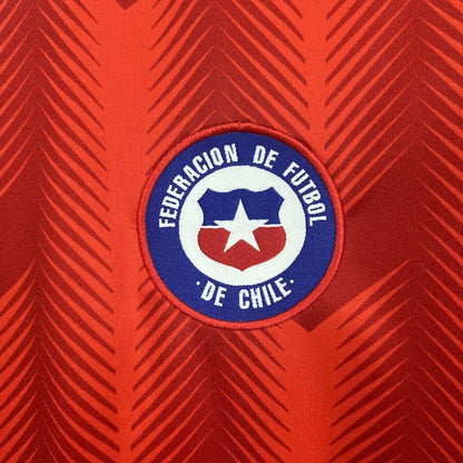 Federacion De Futbol De Chile logo on their 2026 home red jersey.