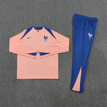 Front view of the France 25/26 Quarter-Zip Tracksuit Pink & Blue.