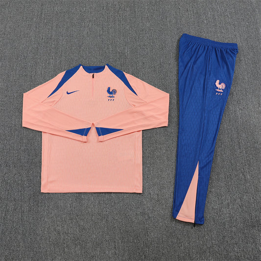 Front view of the France 25/26 Quarter-Zip Tracksuit Pink & Blue.