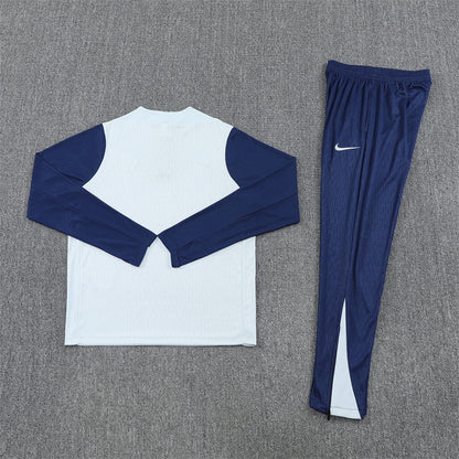 Inter Milan 25/26 Quarter-Zip Tracksuit back view white top and blue pants