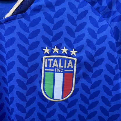 Close-up of Italy 2026 Worldcup Home blue sports jersey with 'Italia' logo featuring stars and colors.