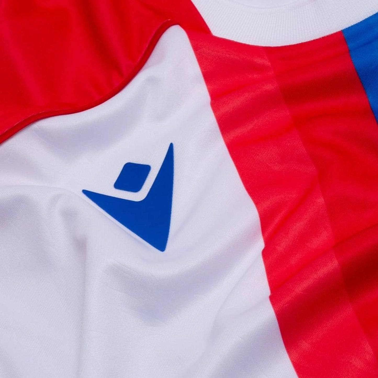 Macron logo view on the Crystal Palace Away Shirt 2025/26