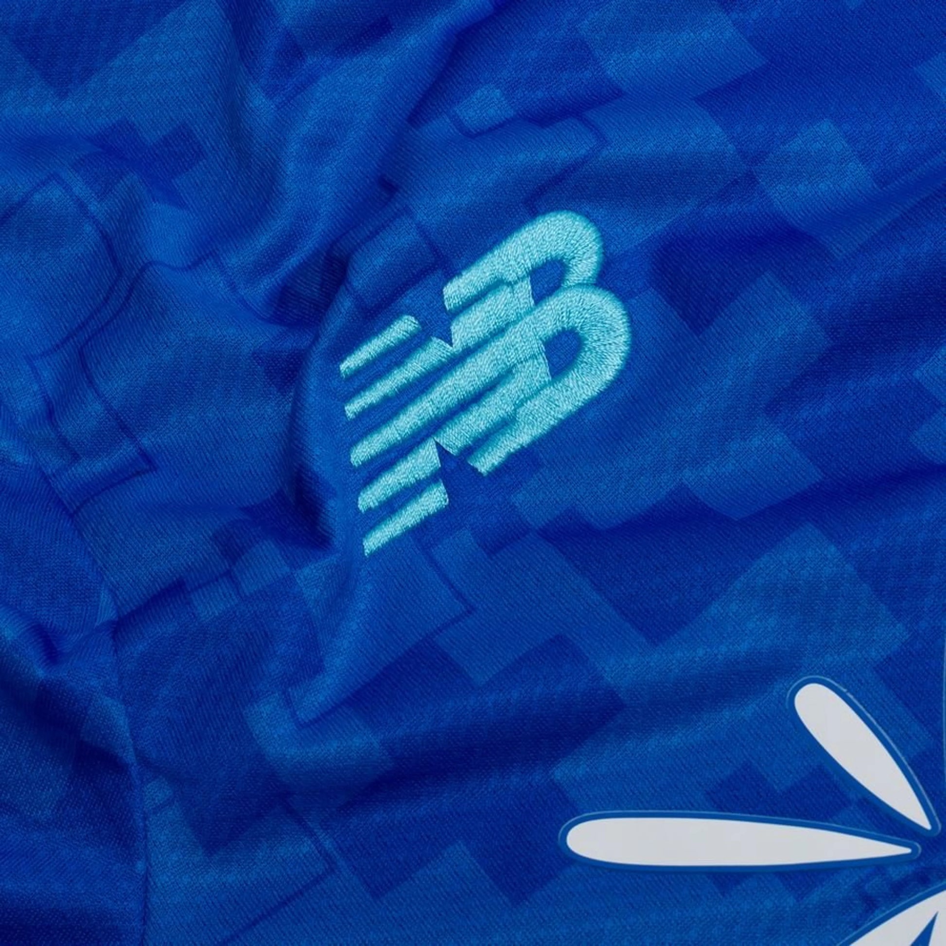 New Balance logo view on the Bayer Leverkusen 2025/26 Third Blue Shirt