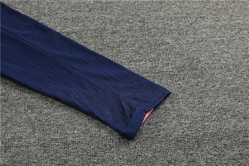 navy sleeve view of the Nike Atletico Madrid 24/25 Quarter Zip Tracksuit.