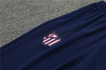 Close up view of the club logo on the pants of Nike Atletico Madrid 24/25 Navy Quarter Zip Tracksuit.