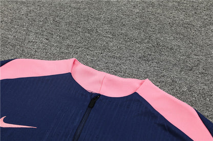 close zipper view of the navy and pink Nike Atletico Madrid 24/25 Quarter Zip Tracksuit