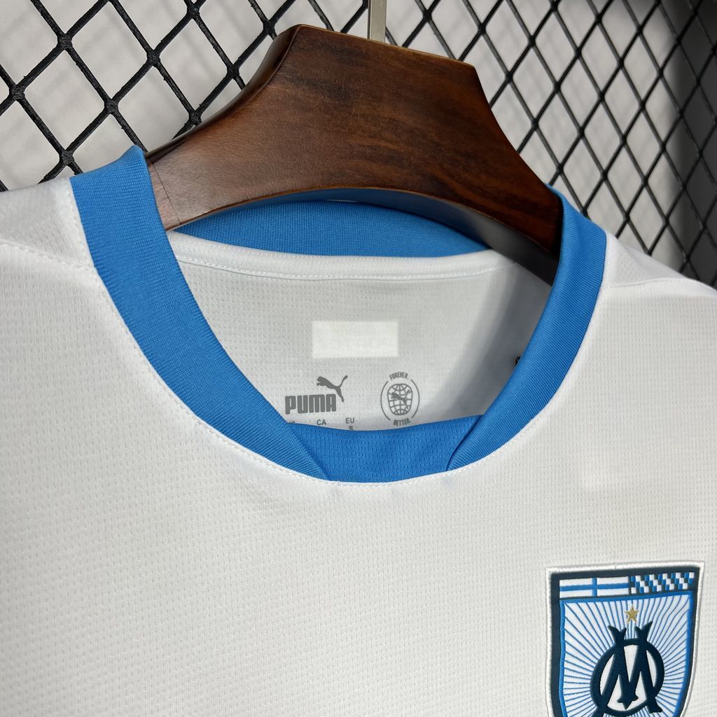 Close up view to the collar of the Olympique Marseille 24/25 Home White Jersey with blue accents.