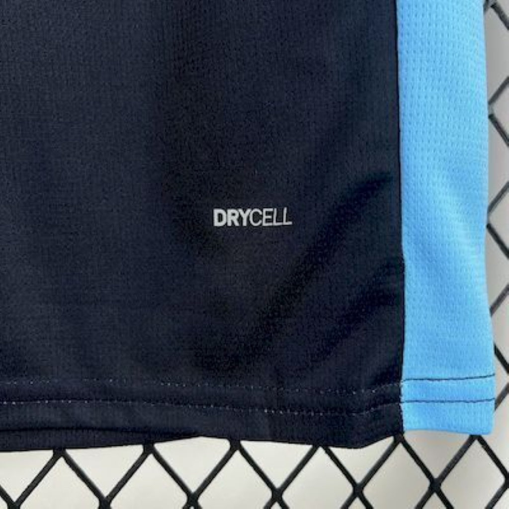 Close-up of Olympique Marseille 25/26 Away Blue Jersey fabric with 'Drycell' branding.
