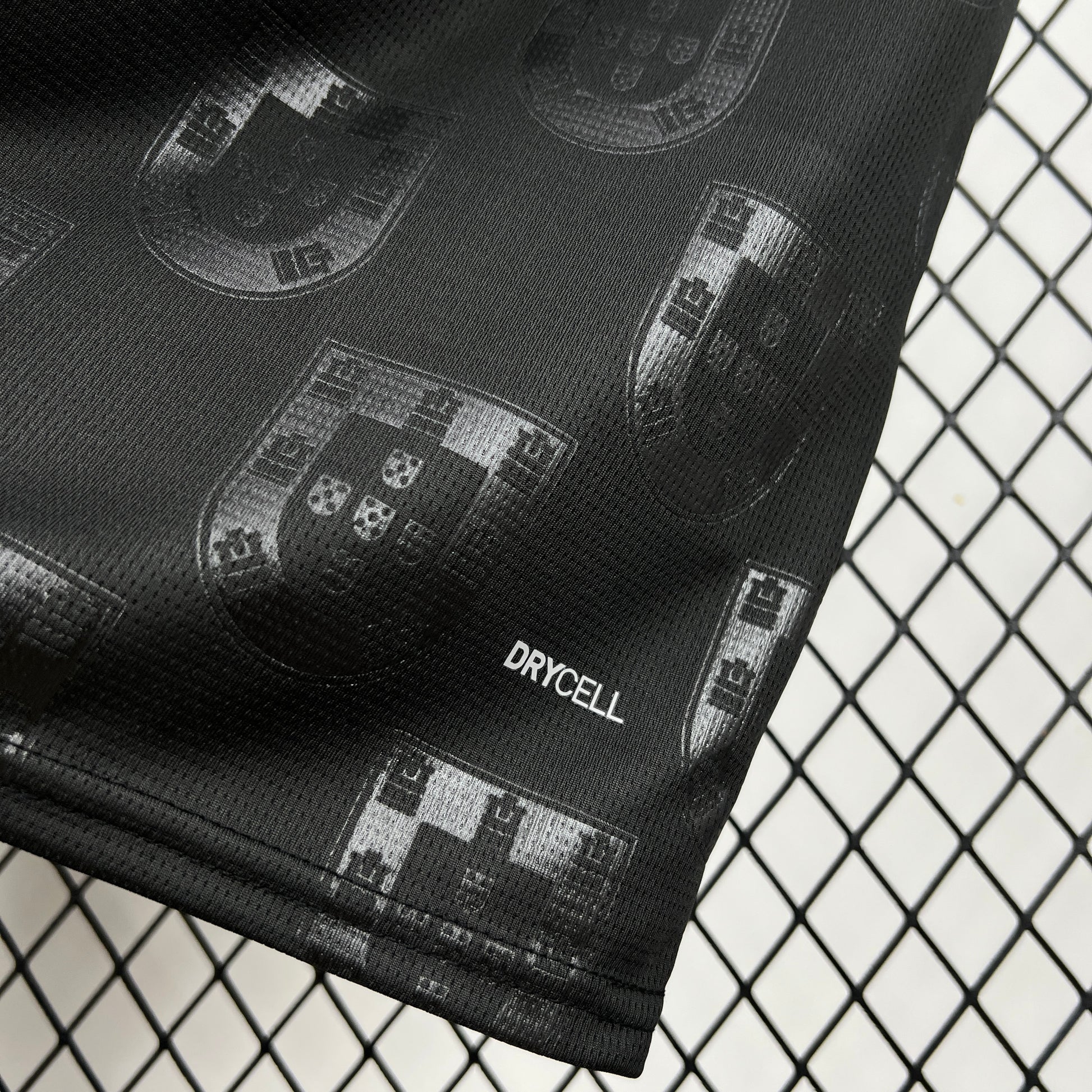 Portugal 2026 Away Black Jersey - close view on the bottom right showing "Drycell" crest.