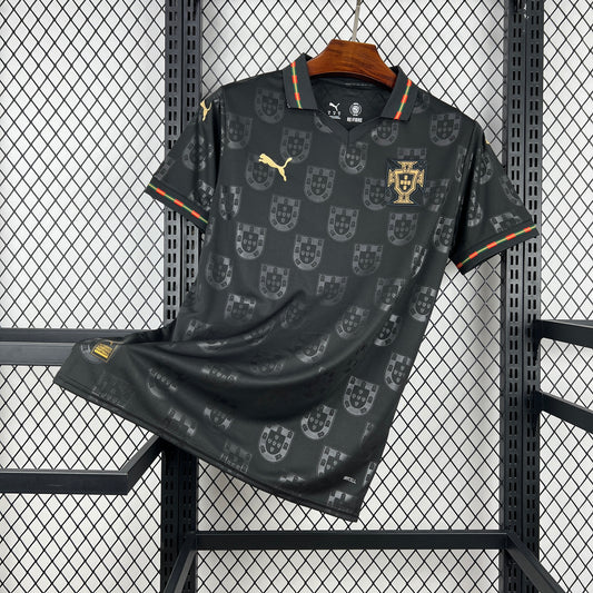Portugal 2026 Away sports jersey with pattern and portugal/puma brand logo on a hanger against a grid background.