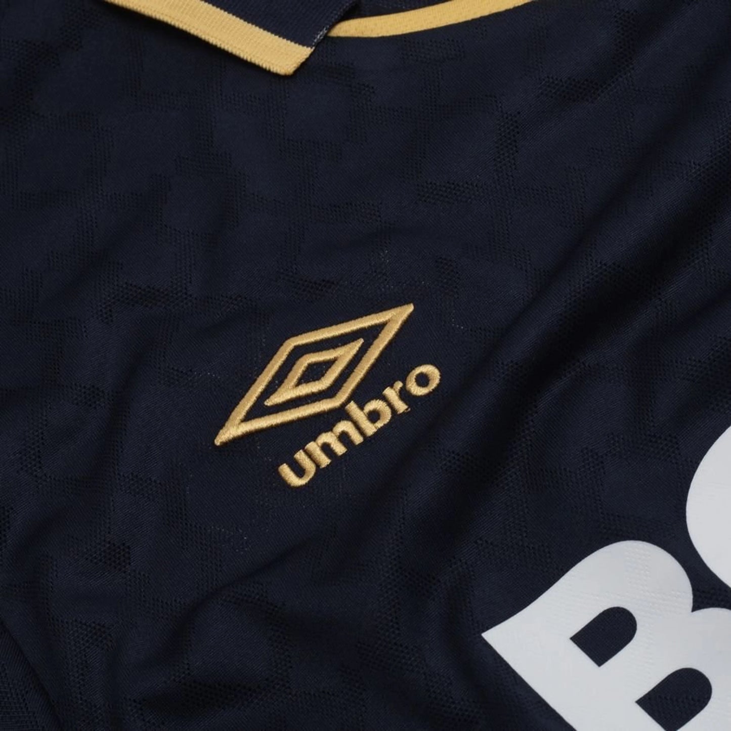 Umbro logo view on the West Ham United 2025/26 Third Navy Shirt