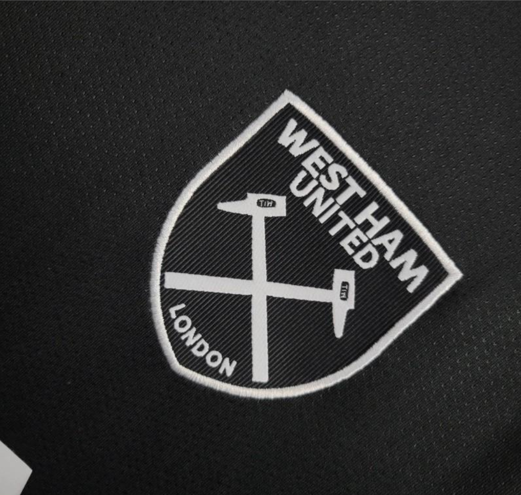 close view of the logo on the West Ham United 2024/2025 Away Black Jersey