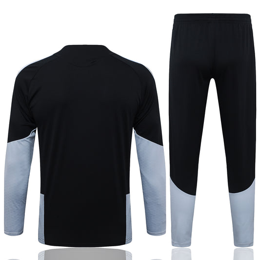 back view of the Adidas Real Madrid 2026/27 Full Black Quarter-Zip Soccer Tracksuit - AEROREADY Training Set