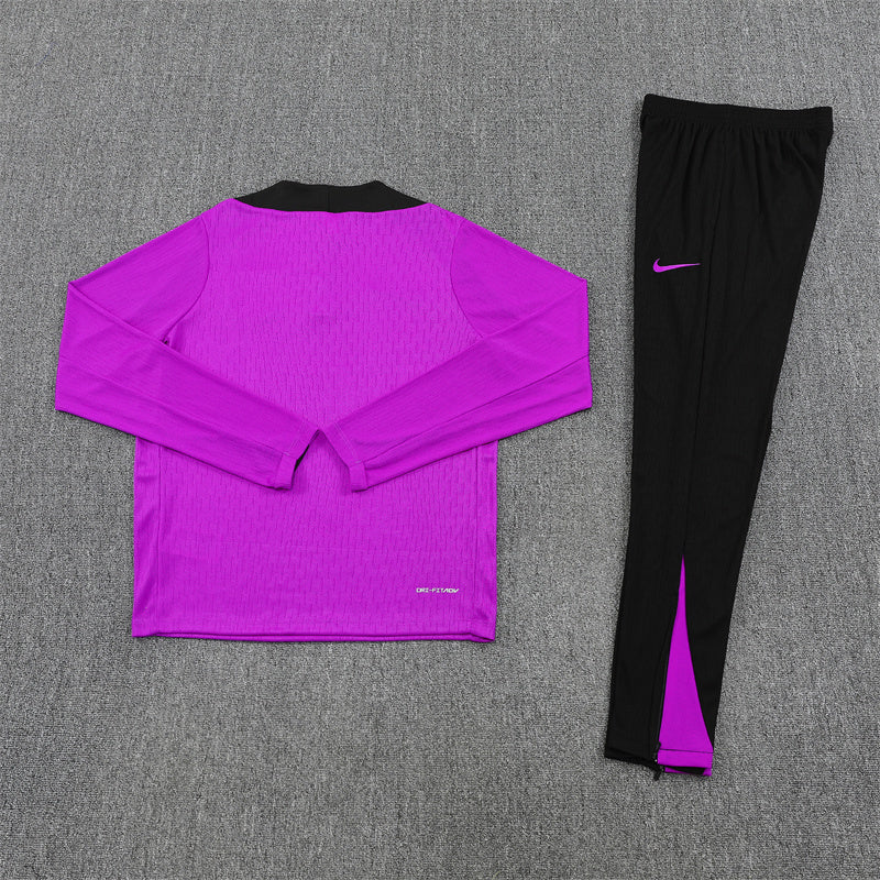 back view of the England 25/26 Quarter-Zip Tracksuit with purple top and navy pants