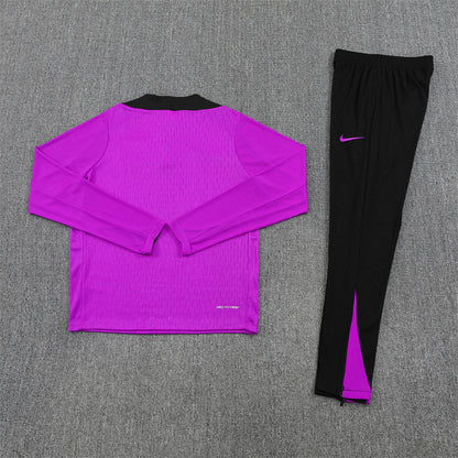 back view of the England 25/26 Quarter-Zip Tracksuit with purple top and navy pants