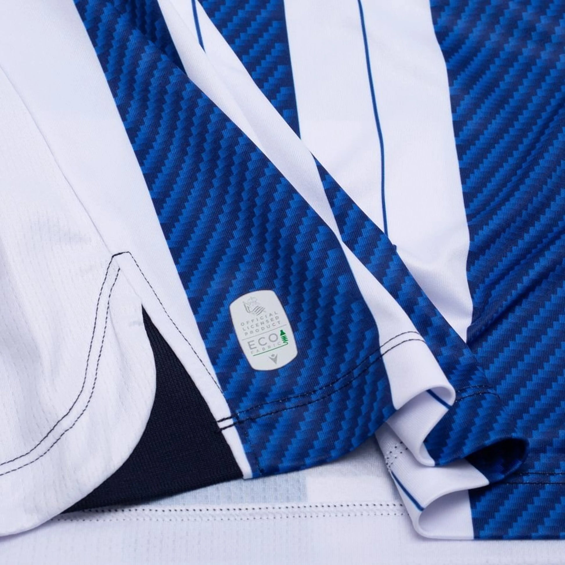 bottom left view of the Macron Real Sociedad 2025/26 Home Blue and White Shirt