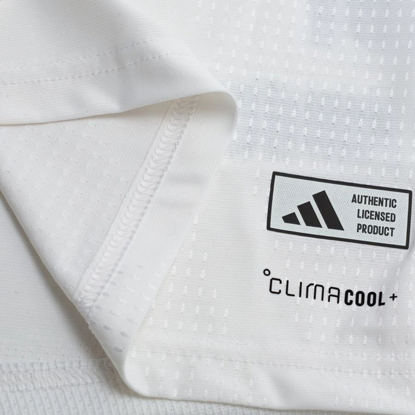 bottom left view of the adidas Germany 2026 World Cup Home Authentic Long Sleeve Jersey in White Black Red Yellow