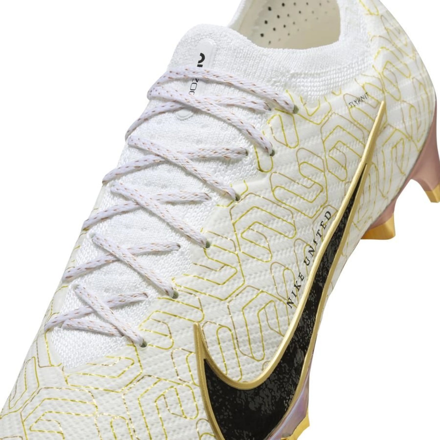 close up view of the Nike Air Zoom Mercurial Vapor 15 Elite FG "United Golden" pack in a White/Black/Gold colorway