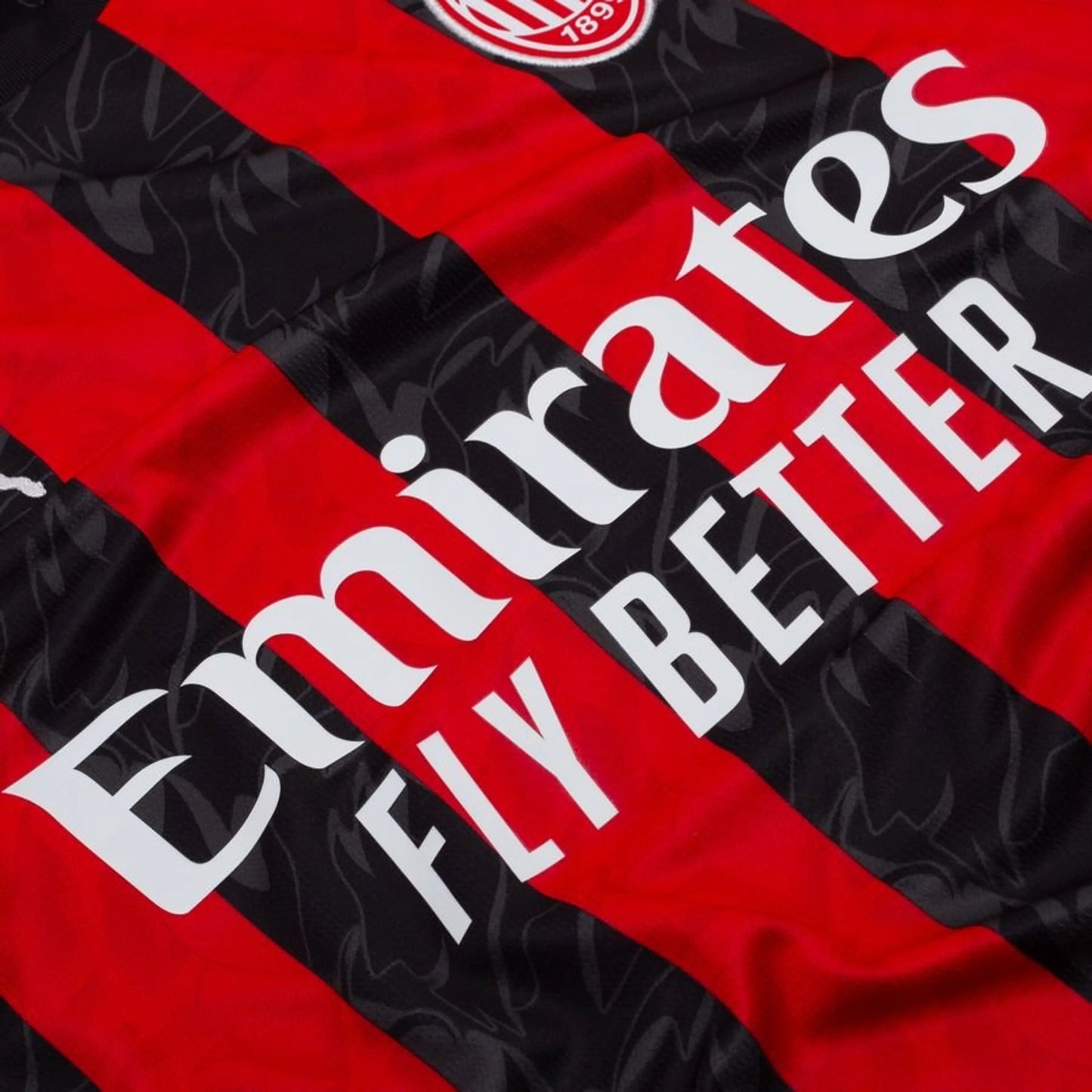 close up view of the PUMA AC Milan 2025/26 Home Long Sleeve Black & Red Jersey