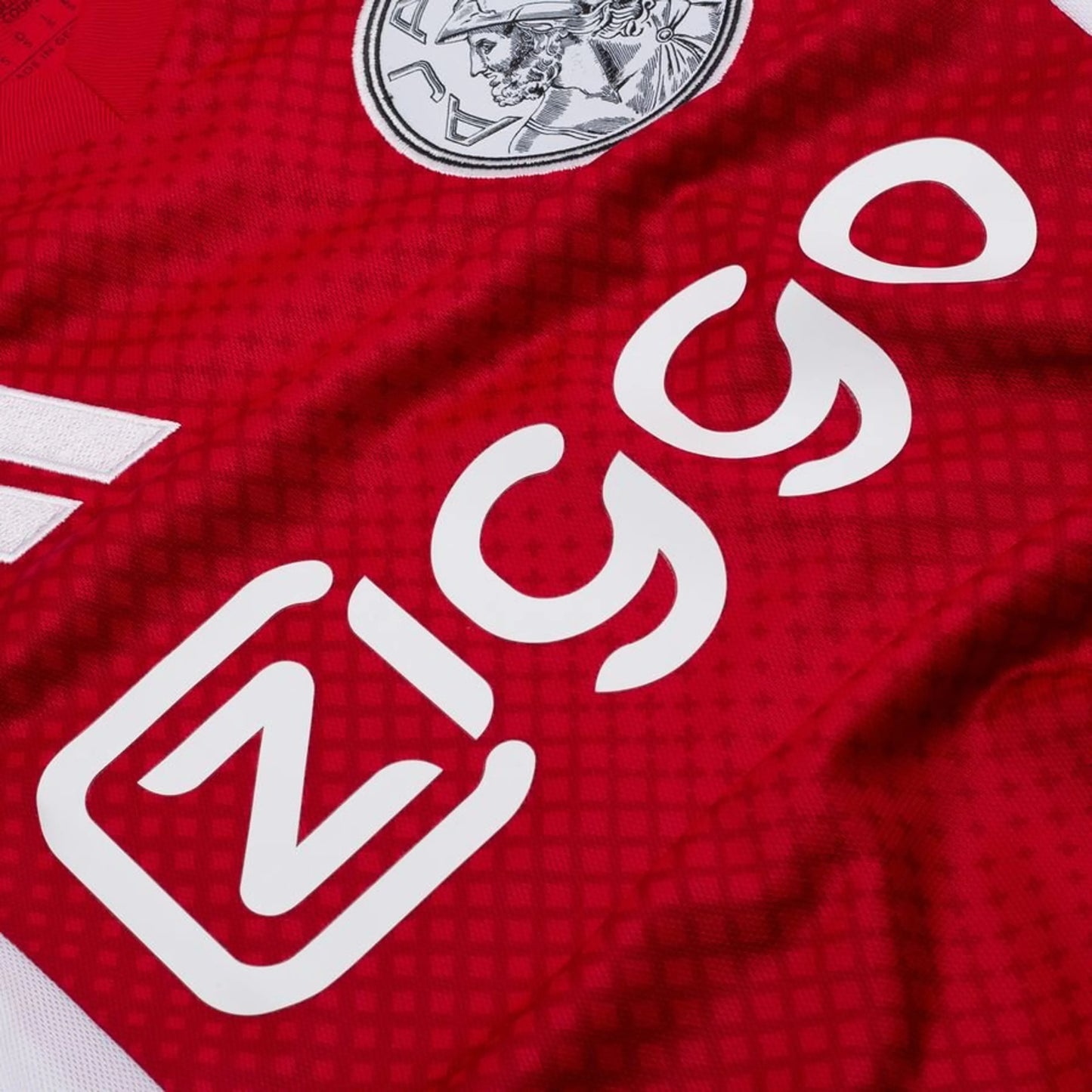 close up view of the adidas Ajax 2025/26 Home Red and White Shirt