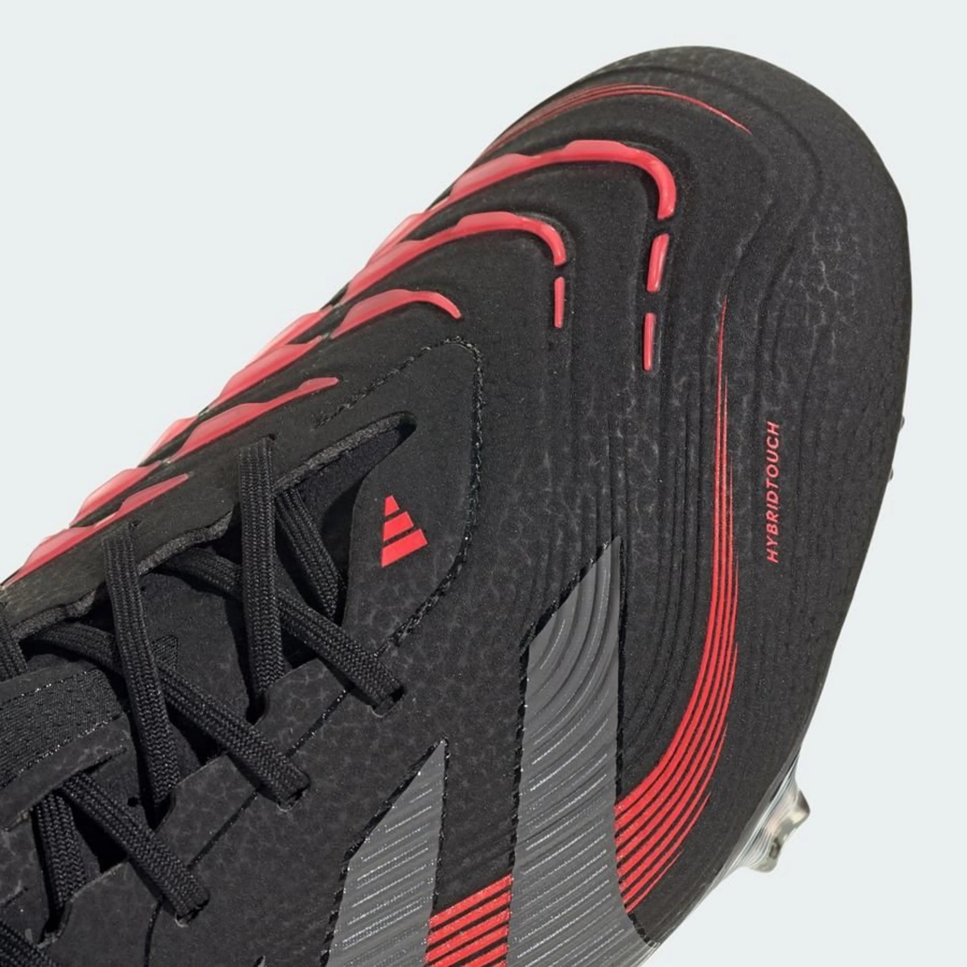 close up view of the adidas Predator Elite FG "Stealth Victory" pack in a Black/Red/Grey colorway