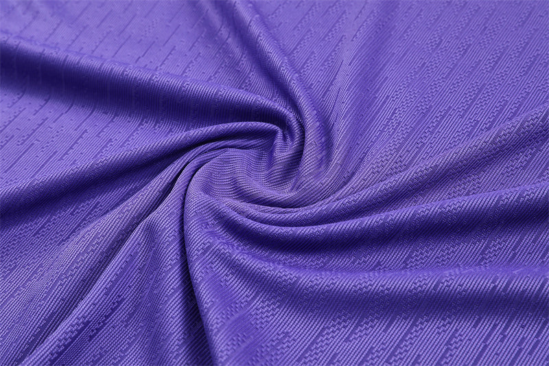 close up view of the Atletico Madrid 25/26 Quarter-Zip Tracksuit Purple/Pink/Navy colorway