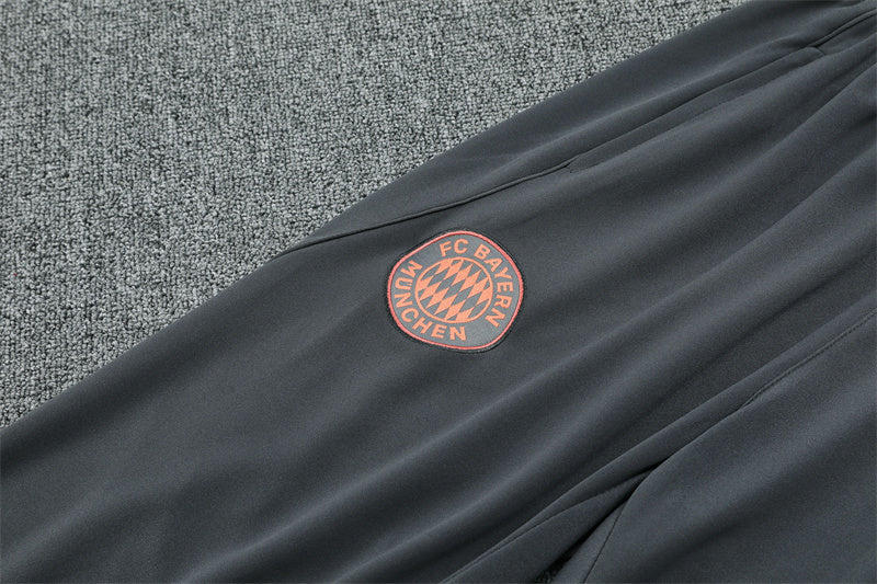 Bayern Munich 25/26 Quarter-Zip Tracksuit Orange top and grey pants team logo view