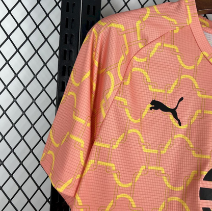 shoulder view of the AC Milan 2025/26 Pre-Match Jersey in Light Orange