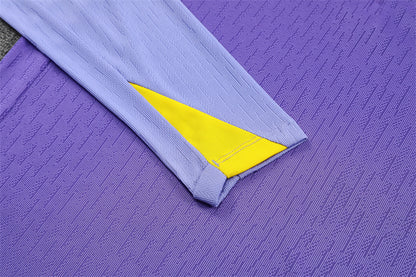 sleeve view on the Atletico Madrid 25/26 Quarter-Zip Tracksuit Purple/Pink/Navy colorway