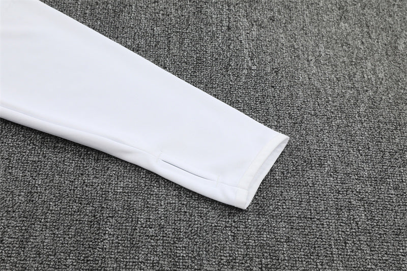 sleeve view of the white top of the Germany 25/26 Quarter-Zip Tracksuit
