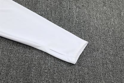 sleeve view of the white top of the Germany 25/26 Quarter-Zip Tracksuit