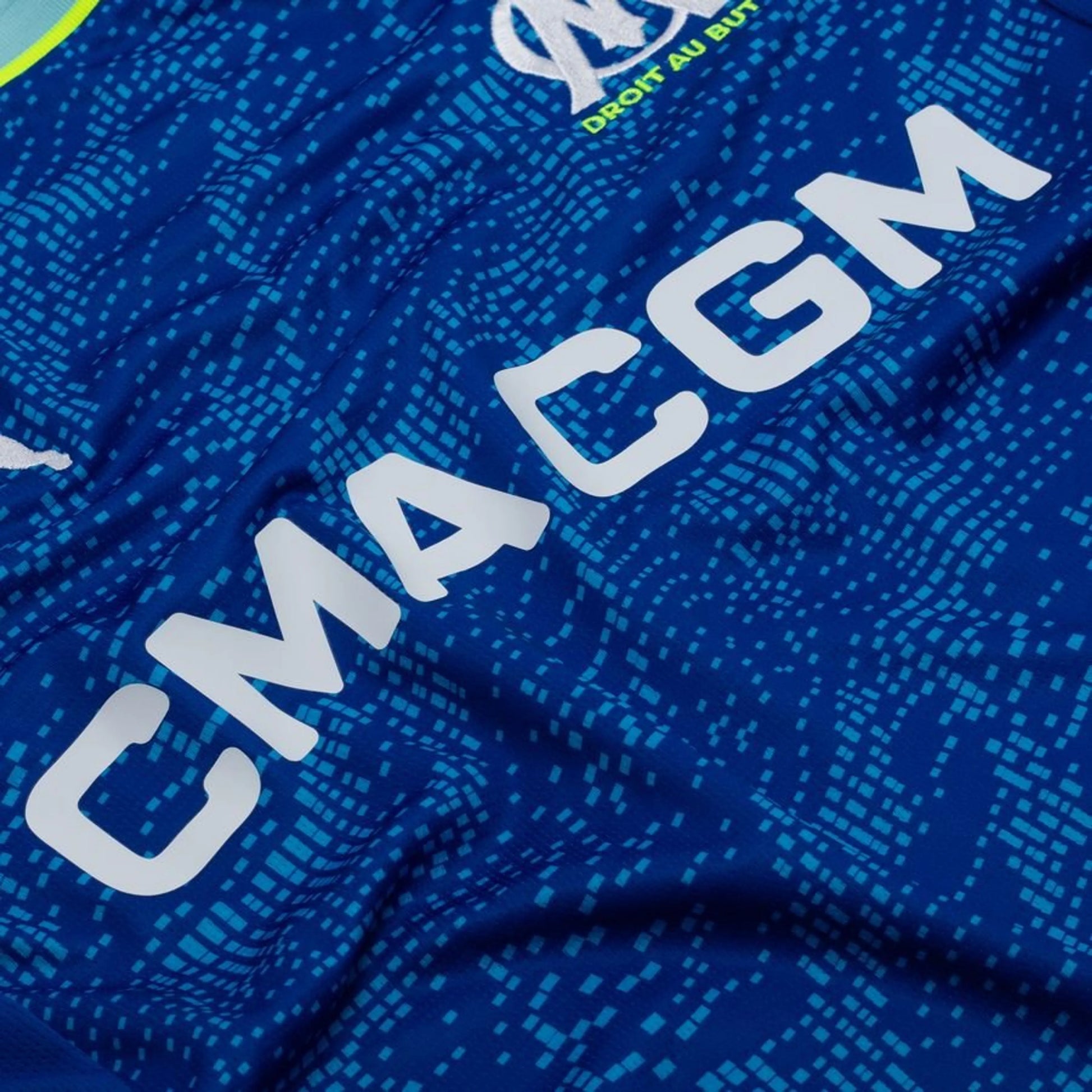 sponsor close up view of the PUMA Marseille 2025/26 Third Shirt - Obsidian/PUMA Gold