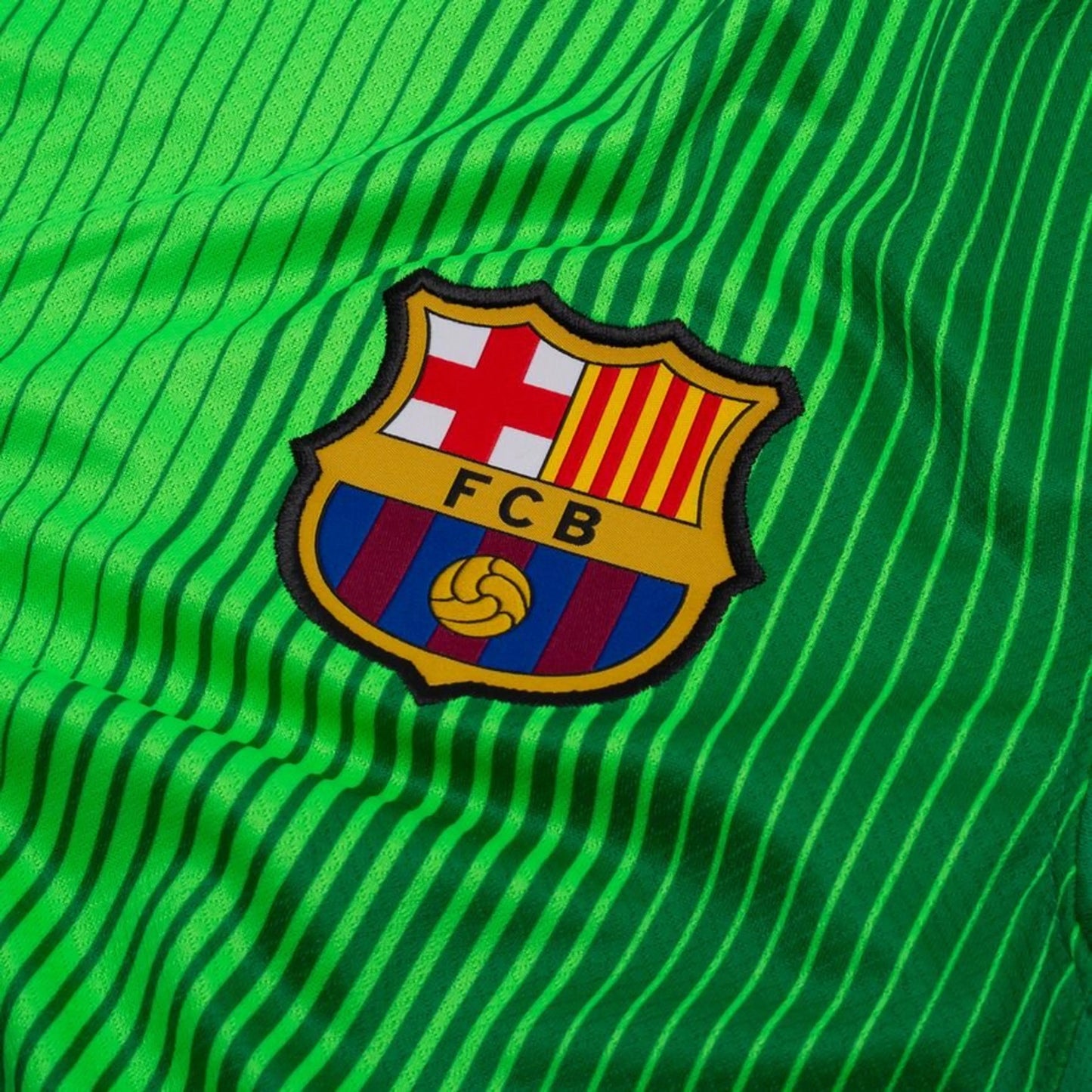 team badge fcb on the Nike FC Barcelona 2025/26 Home Goalkeeper Shirt in Green/Black
