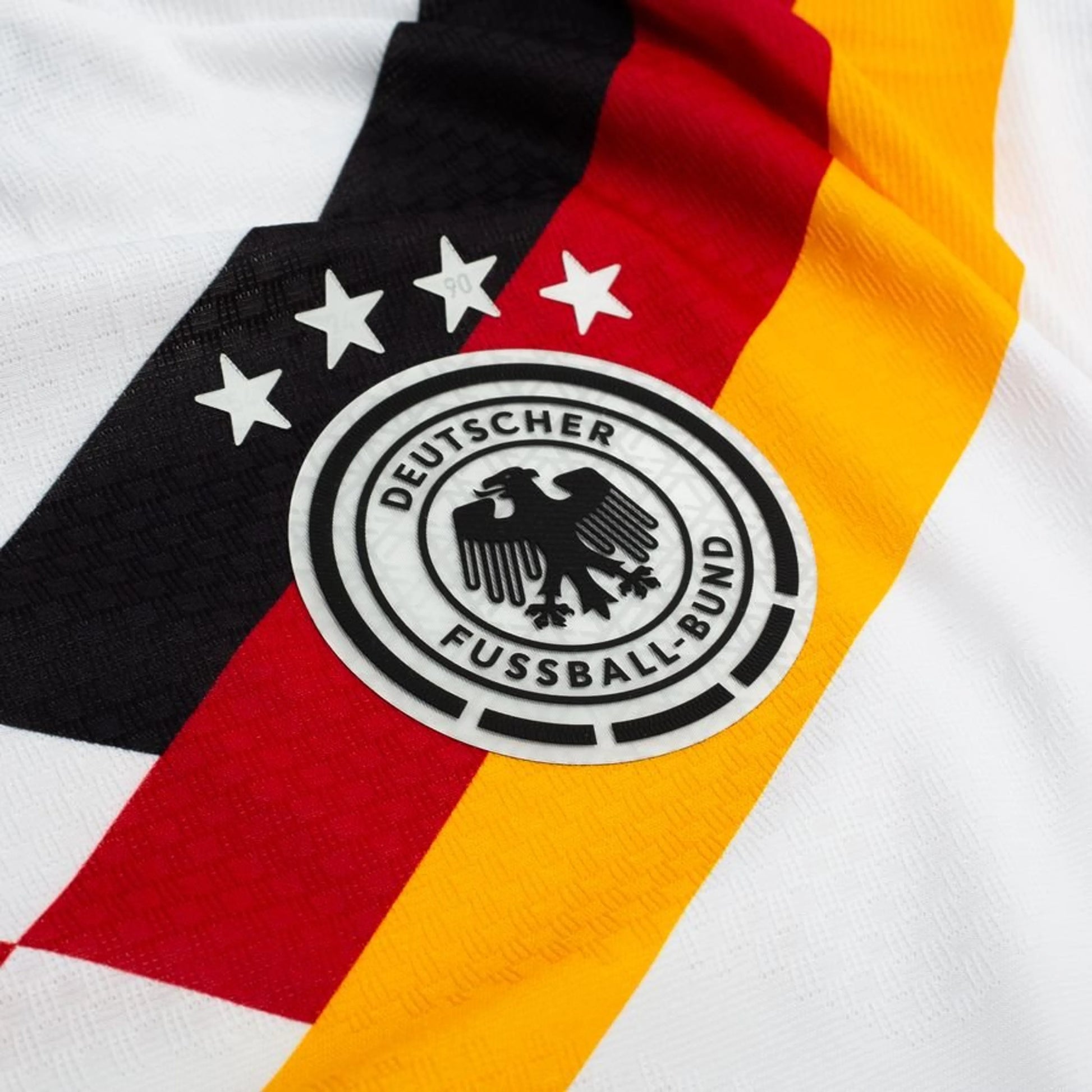team logo on the adidas Germany 2026 World Cup Home Authentic Long Sleeve Jersey in White Black Red Yellow