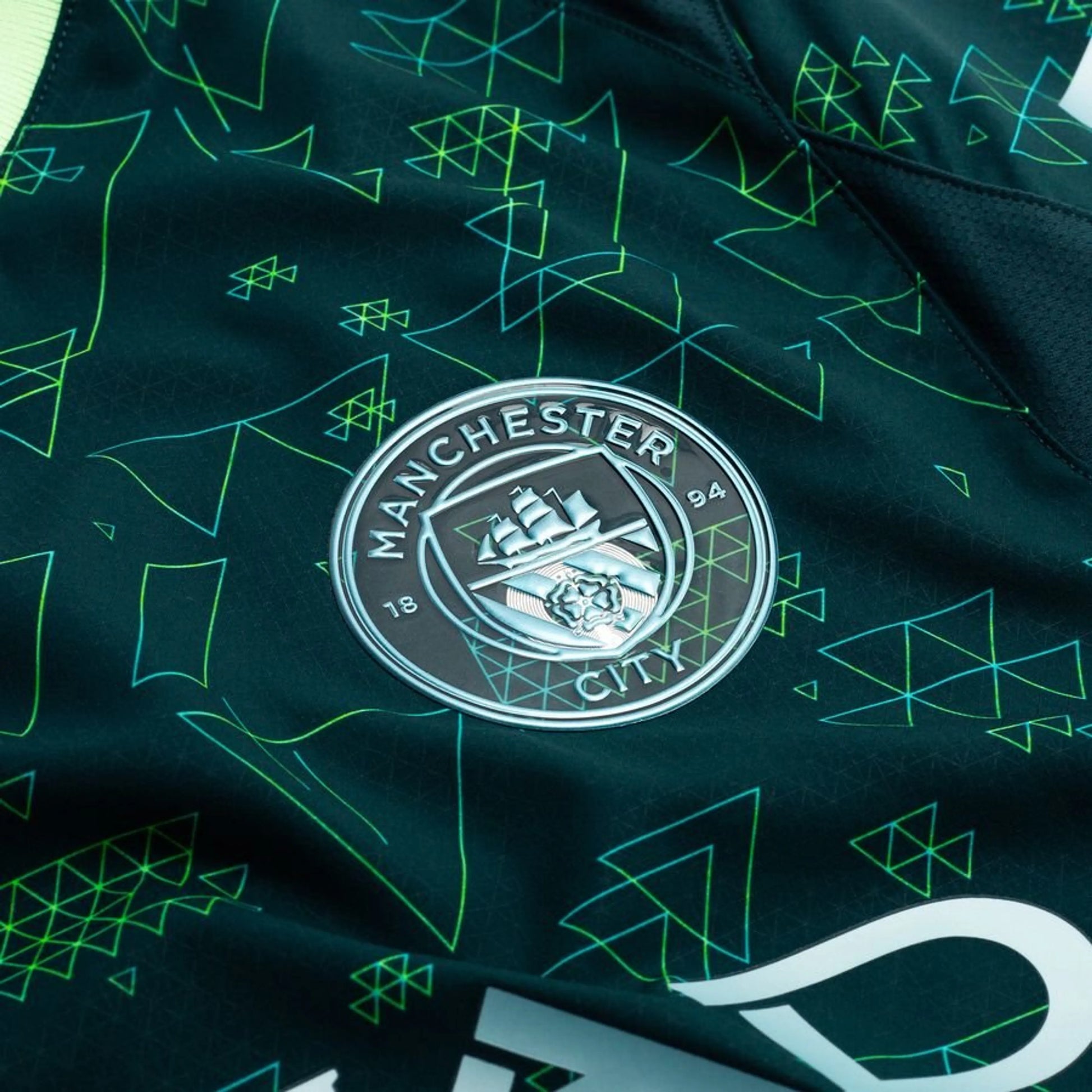team logo on the PUMA Manchester City x EAFC26 Fourth Jersey in Electric Blue and Black