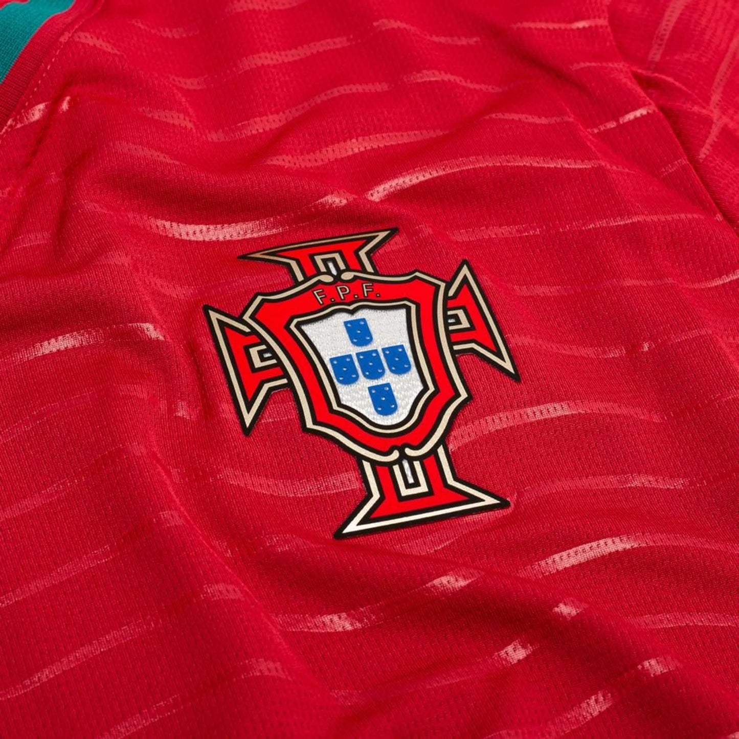 team logo on the PUMA Portugal 2026 World Cup Home Long Sleeve Jersey in Red and Green 