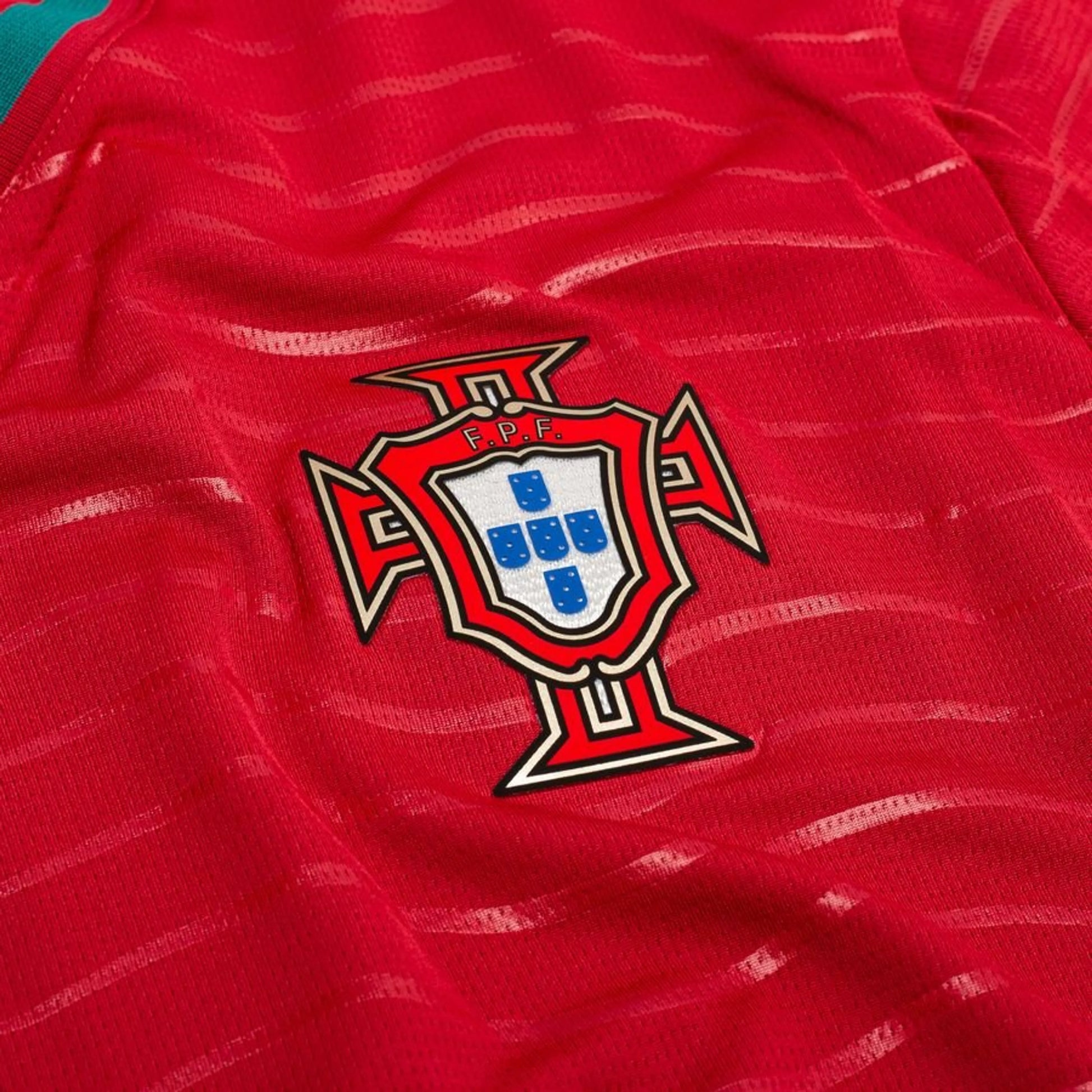 team logo on the PUMA Portugal 2026 World Cup Home Long Sleeve Jersey in Red and Green 