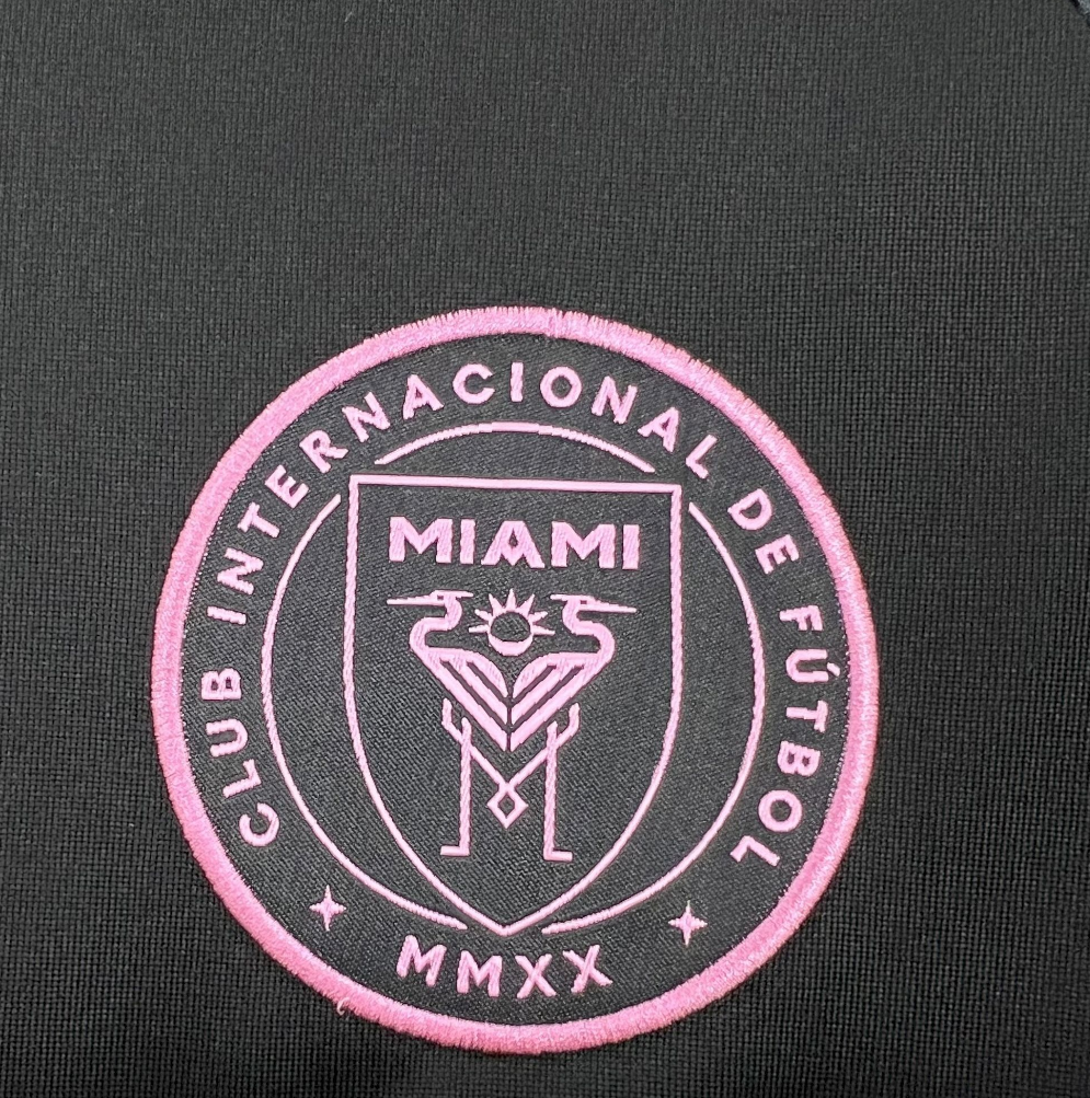 team logo view of the Inter Miami 25/26 Away Black and Pink Football Jersey Designed by Adidas
