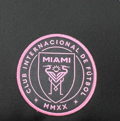 team logo view of the Inter Miami 25/26 Away Black and Pink Football Jersey Designed by Adidas