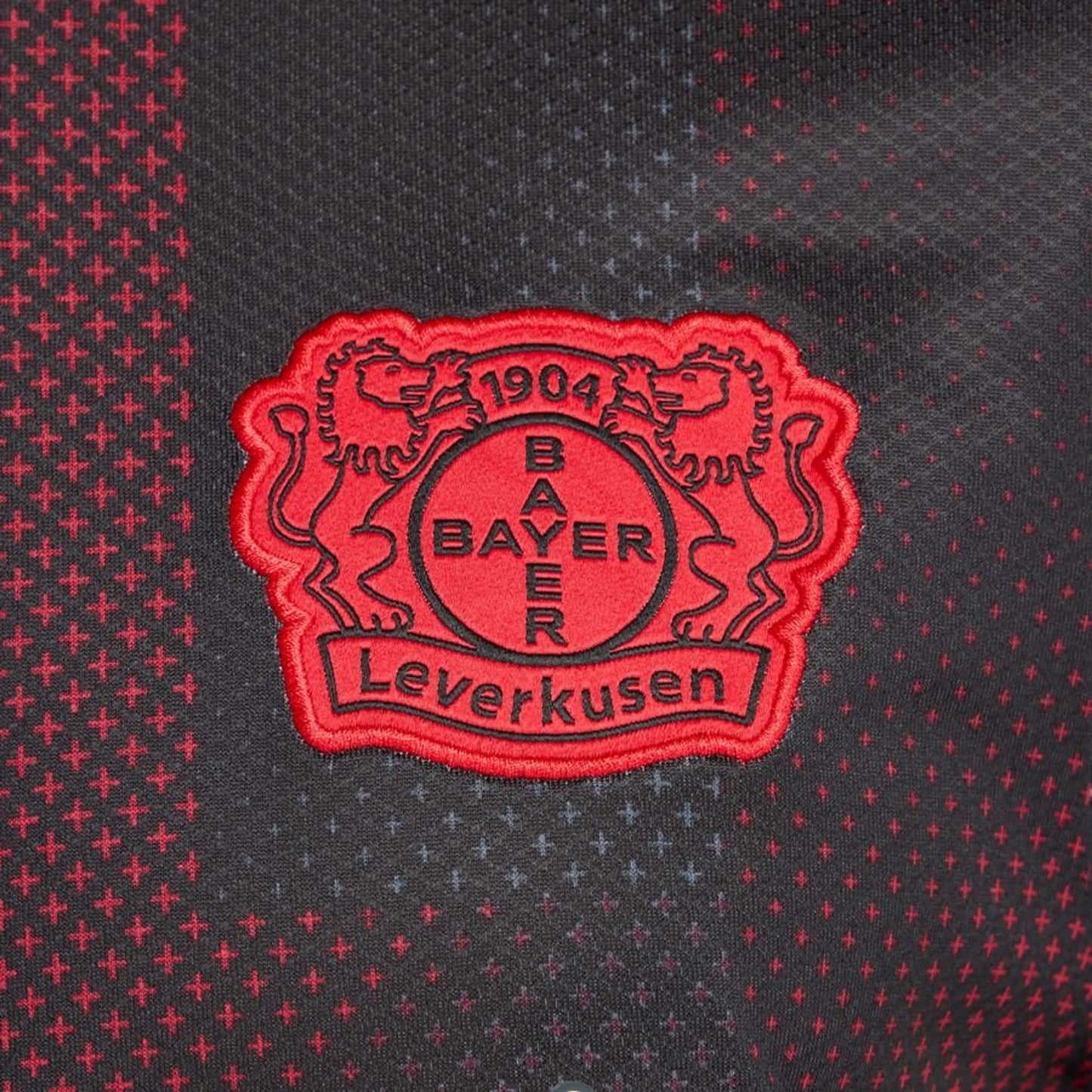 team logo view on the New Balance Bayer Leverkusen 2025/26 Home Black Shirt